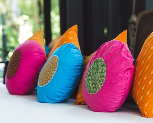 Multicolor round pillows on sofa